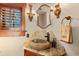 Elegant bathroom featuring a stone sink, granite countertops, and decorative lighting at 220 Cottonwood Cir, Breckenridge, CO 80424