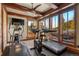 Well-equipped exercise room offering treadmills, stationary bike, and stunning mountain views at 220 Cottonwood Cir, Breckenridge, CO 80424