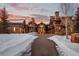 Stunning exterior of a luxurious home with a stone and wood facade at sunset at 220 Cottonwood Cir, Breckenridge, CO 80424