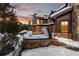 Luxury home exterior featuring a hot tub and outdoor seating, blending comfort with natural beauty at 220 Cottonwood Cir, Breckenridge, CO 80424