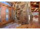 Beautiful foyer featuring a stone wall and a wood door at 220 Cottonwood Cir, Breckenridge, CO 80424