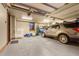 Spacious garage with a car, storage and large windows allowing natural light to illuminate the interior at 220 Cottonwood Cir, Breckenridge, CO 80424