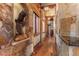 Charming hallway features stone accents, wood floors, and custom lighting at 220 Cottonwood Cir, Breckenridge, CO 80424