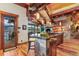 Kitchen with a stone island, wood beams, and views at 220 Cottonwood Cir, Breckenridge, CO 80424