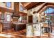 Open kitchen featuring stone accents, wood floors, and eat-in bar at 220 Cottonwood Cir, Breckenridge, CO 80424