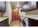Laundry room features granite countertops, custom cabinets, and modern washer and dryer at 220 Cottonwood Cir, Breckenridge, CO 80424