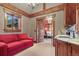 Comfortable sitting area with wet bar, wood beams, and a view into the bedroom at 220 Cottonwood Cir, Breckenridge, CO 80424