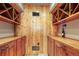 Custom wine cellar featuring wood cabinetry, wine racks, and climate control for optimal storage at 220 Cottonwood Cir, Breckenridge, CO 80424