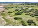 Expansive aerial view of land, home, and outbuildings at 225 Briscoe Ln, Castle Rock, CO 80109