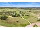 Aerial view of property showcasing the home, barn, and sprawling land at 225 Briscoe Ln, Castle Rock, CO 80109