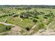 Drone shot features the home and its surrounding acreage in an open valley at 225 Briscoe Ln, Castle Rock, CO 80109