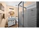 Full bathroom featuring a vanity, toilet, glass shower doors, and decorative mirror at 225 Briscoe Ln, Castle Rock, CO 80109