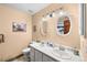 Bright bathroom with double vanity and decorative mirrors at 225 Briscoe Ln, Castle Rock, CO 80109