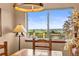 Bright dining area offering scenic views and a modern light fixture at 225 Briscoe Ln, Castle Rock, CO 80109