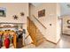Welcoming foyer with decorative accents leads to carpeted stairs and showcases views into the living room at 225 Briscoe Ln, Castle Rock, CO 80109