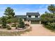 Charming home exterior with well-manicured front yard and mature trees at 225 Briscoe Ln, Castle Rock, CO 80109