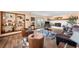 Cozy living room with brick fireplace, hardwood floors, western decor, and a comfortable seating area at 225 Briscoe Ln, Castle Rock, CO 80109