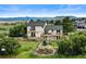 Exterior back of home with landscaped yard, and decks at 225 Briscoe Ln, Castle Rock, CO 80109