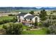 Back exterior of the home with deck and landscaped backyard at 225 Briscoe Ln, Castle Rock, CO 80109