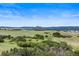 Scenic view overlooking the rolling hills and mountain mesa in the distance, perfect for relaxation at 225 Briscoe Ln, Castle Rock, CO 80109