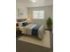 Cozy bedroom with natural light, comfortable bed, and stylish accents at 14500 E 2Nd Ave # 209A, Aurora, CO 80011