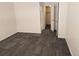 View of a well-lit bedroom with closet door ajar, revealing ample storage space at 14500 E 2Nd Ave # 209A, Aurora, CO 80011