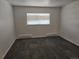 Bright bedroom featuring neutral walls, patterned carpet, and window with blinds for natural light at 14500 E 2Nd Ave # 209A, Aurora, CO 80011