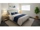 Relaxing bedroom with a large window, comfortable bed, and tasteful decor at 14500 E 2Nd Ave # 209A, Aurora, CO 80011