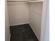 Inside an empty closet, showing the rod and space for hanging and storage at 14500 E 2Nd Ave # 209A, Aurora, CO 80011