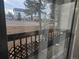 View from a porch overlooking trees and street at 14500 E 2Nd Ave # 209A, Aurora, CO 80011