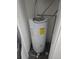 View of a Hotpoint water heater installation in a small utility closet at 14500 E 2Nd Ave # 209A, Aurora, CO 80011