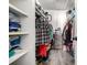 Large walk-in closet with ample shelving and storage at 943 S Zeno Way # 206, Aurora, CO 80017