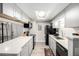 Modern kitchen with gray cabinets and stainless steel appliances at 943 S Zeno Way # 206, Aurora, CO 80017