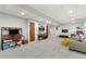 Versatile basement featuring a work area, a comfortable seating area, recessed lighting, and neutral carpet at 300 E Cleveland St, Lafayette, CO 80026