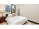 Bright bedroom with a comfortable bed, dresser, and view from the window at 300 E Cleveland St, Lafayette, CO 80026