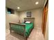 Cozy bedroom features neutral walls and carpet, a small window, and a full-size bed at 300 E Cleveland St, Lafayette, CO 80026