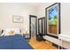 Cozy bedroom featuring a comfortable bed, closet and a large window at 300 E Cleveland St, Lafayette, CO 80026