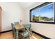 Bright dining area featuring a wooden table with seating for four and a large window with a view at 300 E Cleveland St, Lafayette, CO 80026