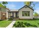 Charming home featuring a front porch, well-maintained lawn and inviting curb appeal at 300 E Cleveland St, Lafayette, CO 80026
