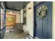 Cozy front porch with seating, adorned with a wreath on the front door at 300 E Cleveland St, Lafayette, CO 80026