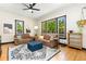 Bright living room with ample natural light, hardwood flooring and comfortable seating at 300 E Cleveland St, Lafayette, CO 80026