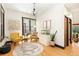 Inviting living room featuring hardwood floors and a decorative area rug with chairs at 300 E Cleveland St, Lafayette, CO 80026