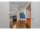 Inviting entryway with hardwood floors, a hall tree, and a glimpse of the living room at 460 S Marion Pkwy # 251, Denver, CO 80209