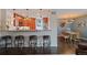 Charming kitchen and breakfast bar with granite counters and stainless appliances, adjoined to a dining area at 460 S Marion Pkwy # 251, Denver, CO 80209