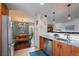 Updated kitchen with stainless appliances, granite countertops, and easy access to the dining and living area at 460 S Marion Pkwy # 251, Denver, CO 80209