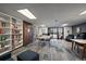 Community library with extensive bookshelves, comfortable seating, and natural light, perfect for reading and studying at 460 S Marion Pkwy # 251, Denver, CO 80209