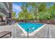 Inviting outdoor pool surrounded by lush greenery and comfortable lounge chairs, perfect for relaxation and recreation at 460 S Marion Pkwy # 251, Denver, CO 80209