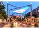 Stylish street view at dusk, showcasing modern architecture and vibrant lighting in a thriving neighborhood at 460 S Marion Pkwy # 251, Denver, CO 80209