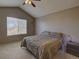 Cozy bedroom featuring a queen size bed and a vaulted ceiling at 1057 English Sparrow Trl, Highlands Ranch, CO 80129