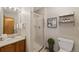 Cozy bathroom featuring a shower, sink, and decorative wall art at 7345 W 97Th Pl, Broomfield, CO 80021